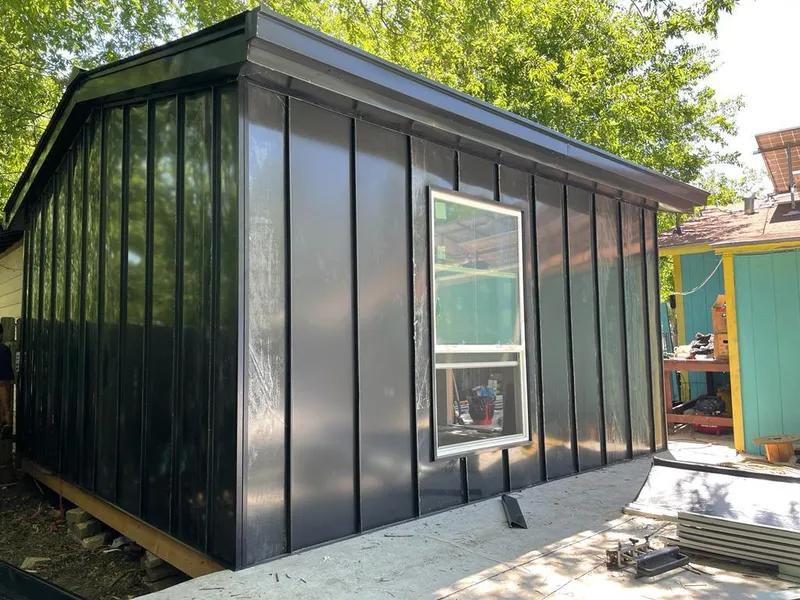 Black standing seam metal wall panels for Roof Inspection in Winter Springs